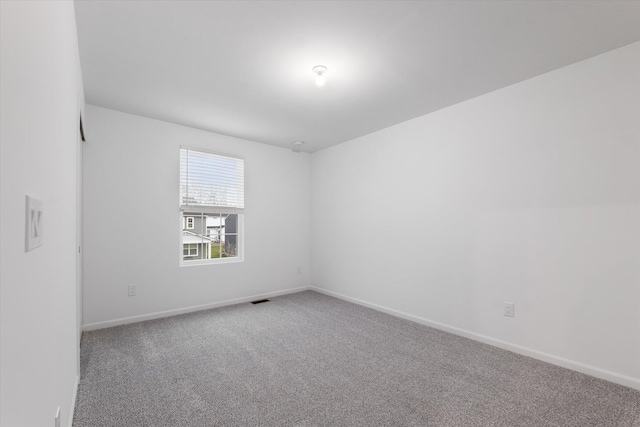 spare room featuring carpet floors