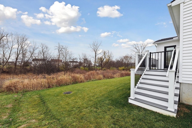 view of yard featuring a wooden deck