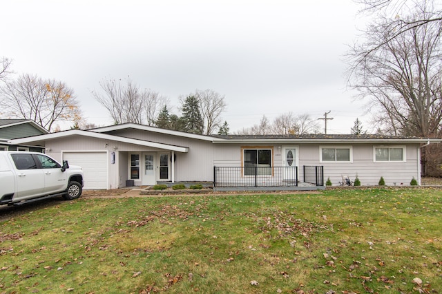 single story home with a front lawn and a garage