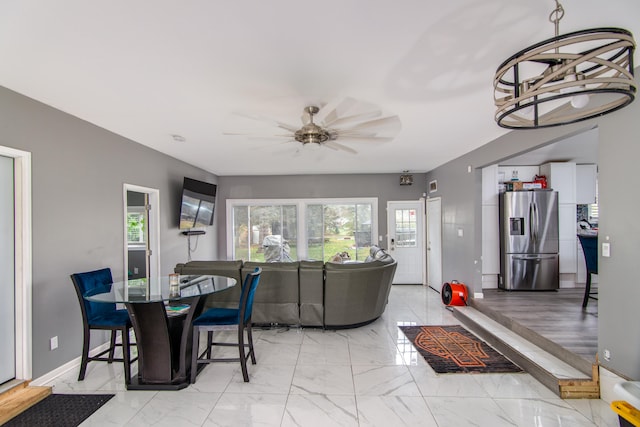 dining space with ceiling fan