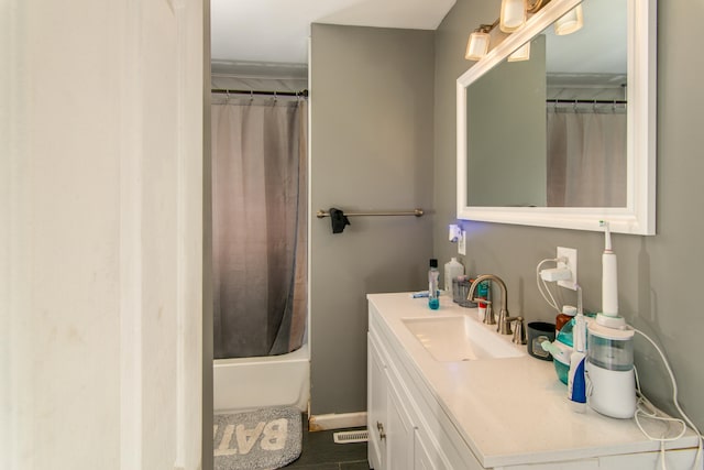 bathroom with vanity and shower / tub combo