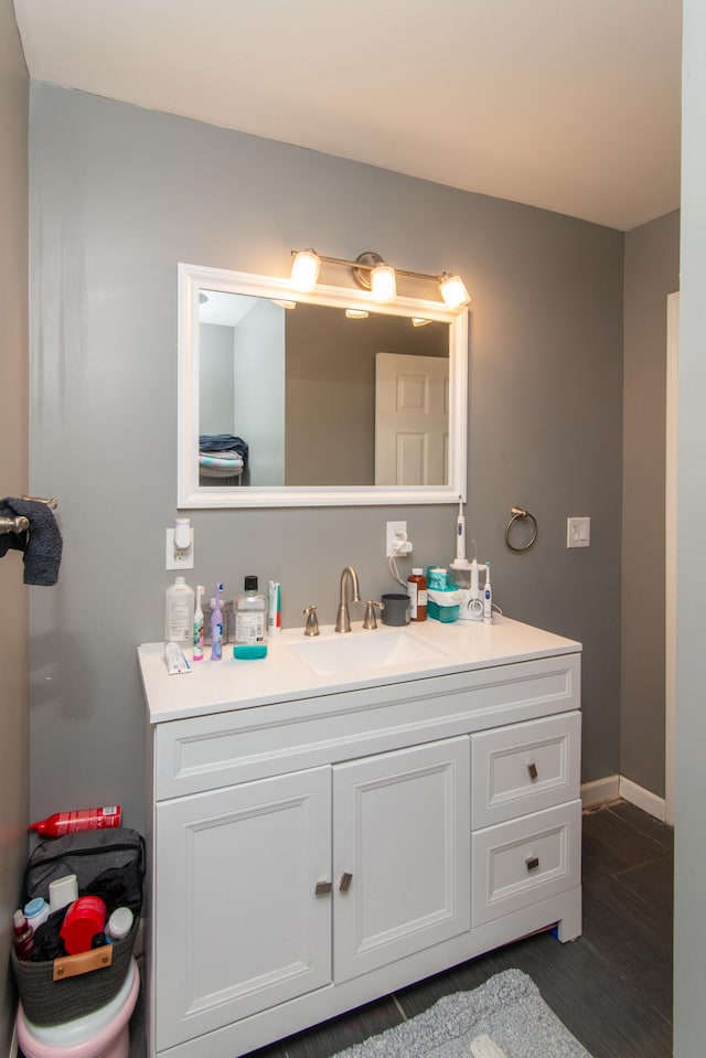 bathroom featuring hardwood / wood-style floors and vanity