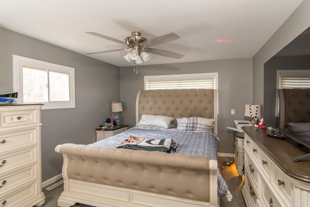 bedroom featuring dark hardwood / wood-style flooring and ceiling fan