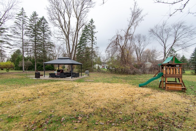 view of yard featuring a gazebo and a playground