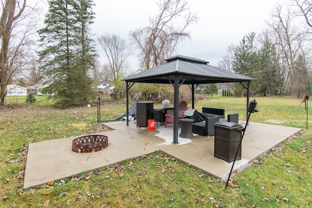 view of patio / terrace featuring a gazebo and an outdoor living space with a fire pit