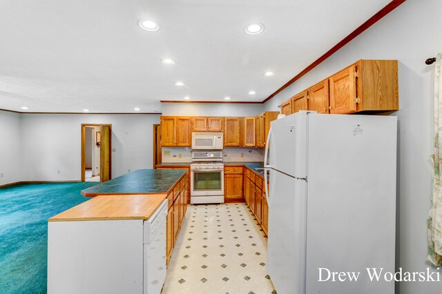 kitchen with white appliances, light colored carpet, and ornamental molding