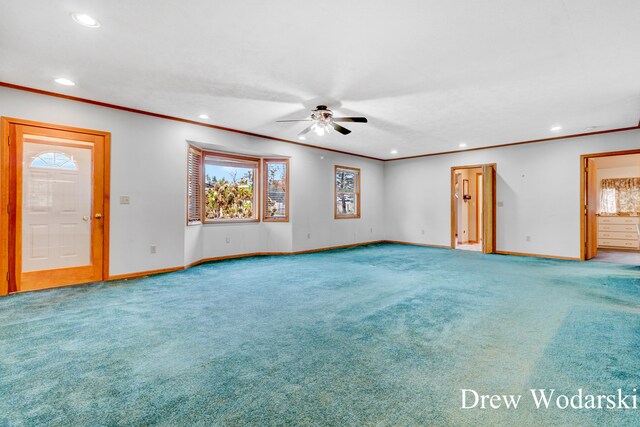 unfurnished living room featuring carpet flooring, ceiling fan, and crown molding