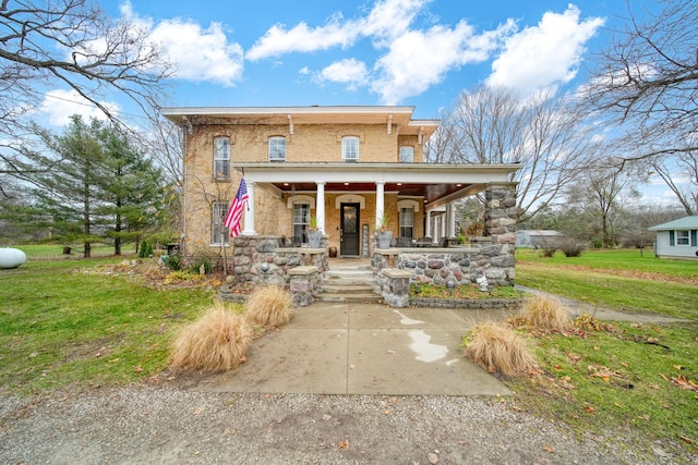 italianate house featuring a front lawn and a porch