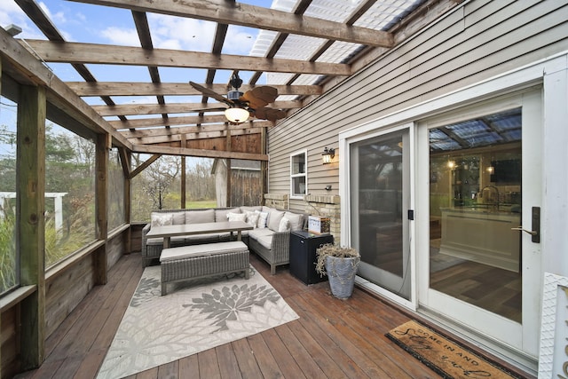 sunroom featuring vaulted ceiling with beams and ceiling fan