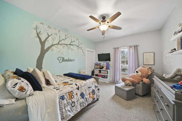 bedroom with ceiling fan and light carpet