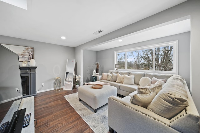 living room with dark hardwood / wood-style flooring