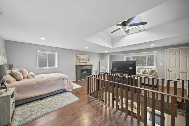 bedroom with ceiling fan and dark wood-type flooring