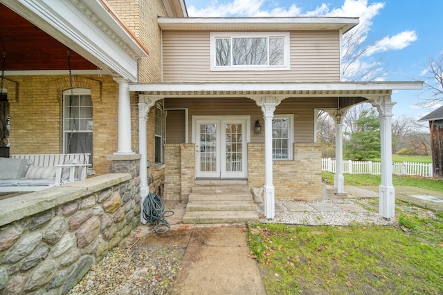 doorway to property with a porch