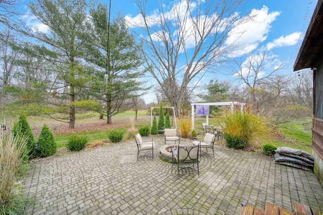 view of patio / terrace featuring a fire pit