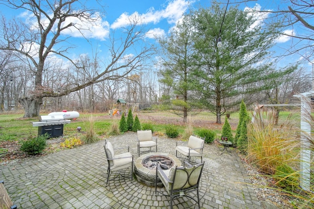 view of patio with a fire pit