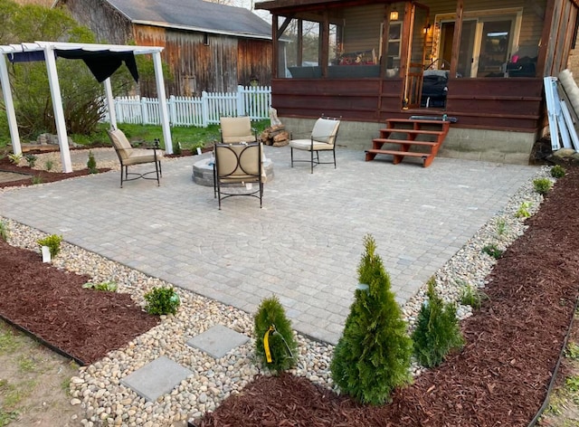 view of patio with a sunroom