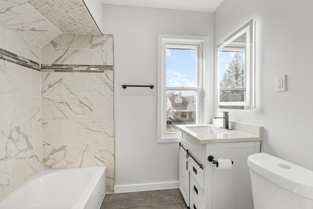 full bathroom featuring tile patterned floors, vanity, toilet, and tiled shower / bath combo