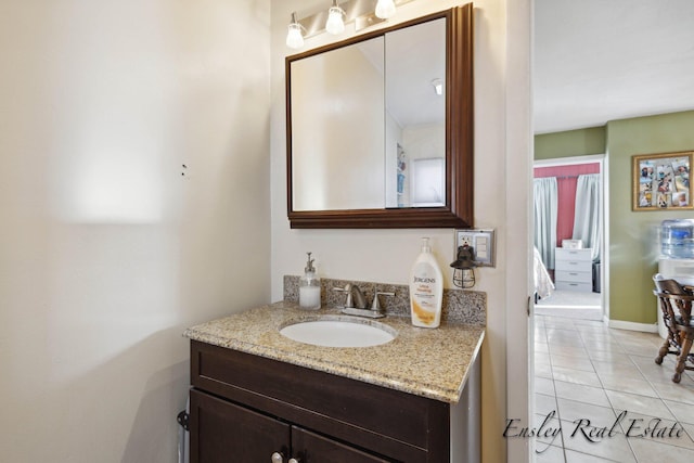 bathroom with tile patterned flooring and vanity