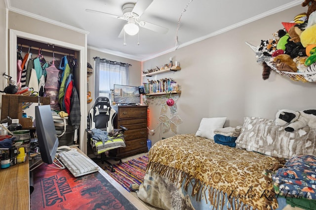 bedroom with wood finished floors, a ceiling fan, and ornamental molding
