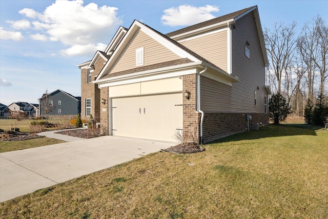 view of home's exterior with a lawn and a garage