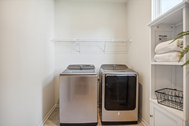 laundry room with washing machine and clothes dryer