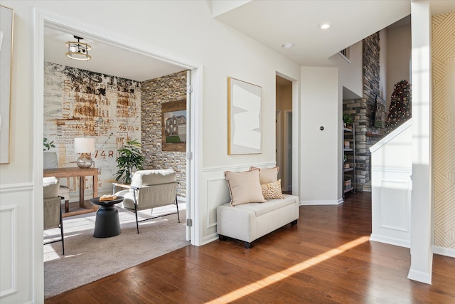 sitting room featuring dark hardwood / wood-style floors