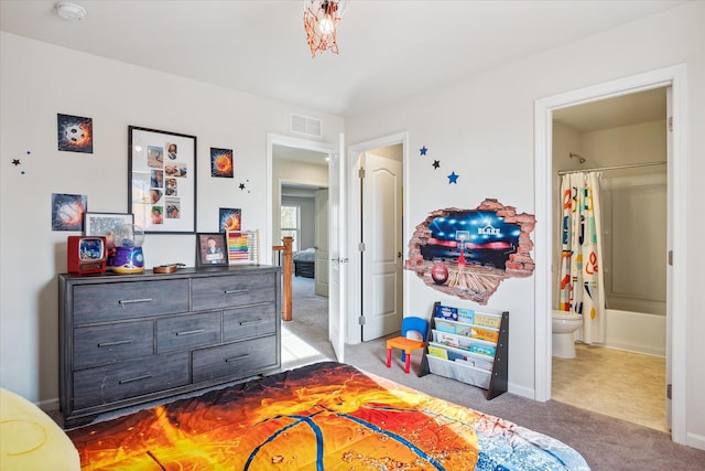 carpeted bedroom featuring connected bathroom