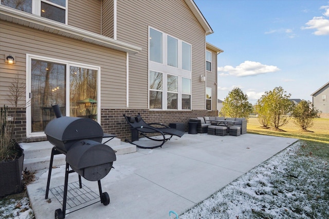 view of patio with area for grilling and an outdoor living space