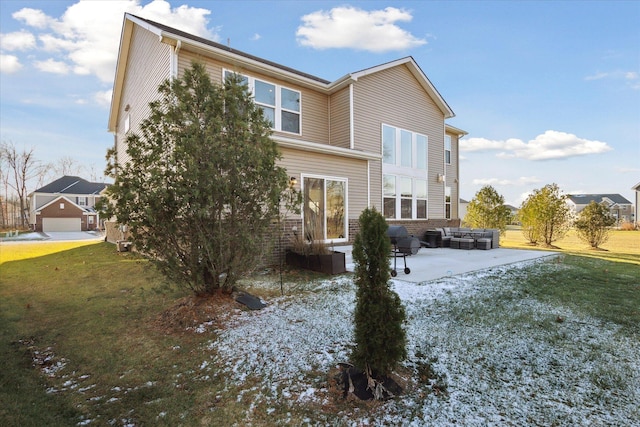 rear view of property with a yard and a patio