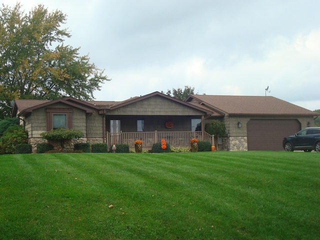 ranch-style home featuring a front lawn and a garage