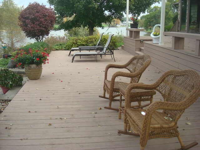 wooden terrace with a water view