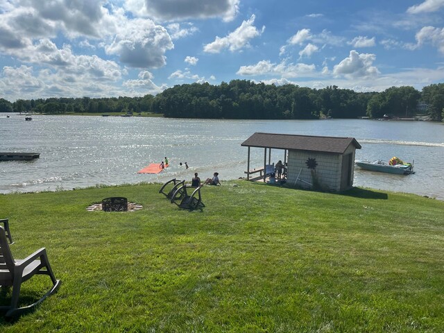 property view of water featuring a fire pit