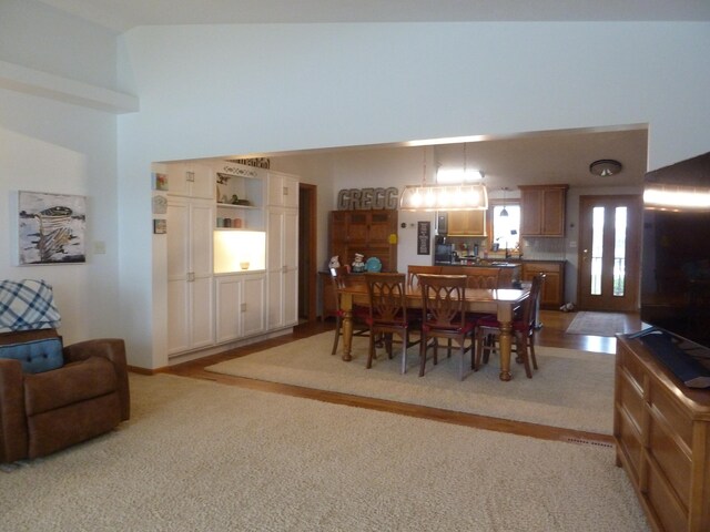 dining room with light colored carpet