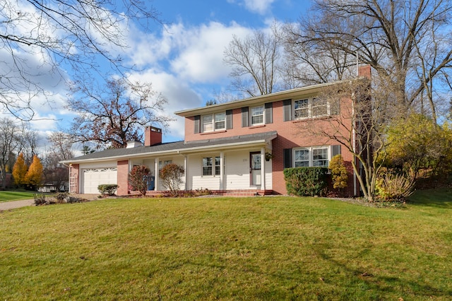 view of front facade with a front lawn and a garage