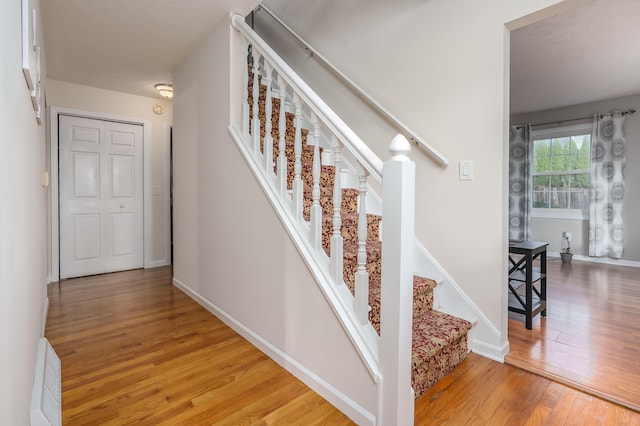 staircase featuring hardwood / wood-style floors