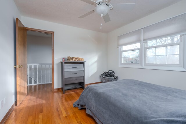 bedroom featuring ceiling fan and light hardwood / wood-style flooring