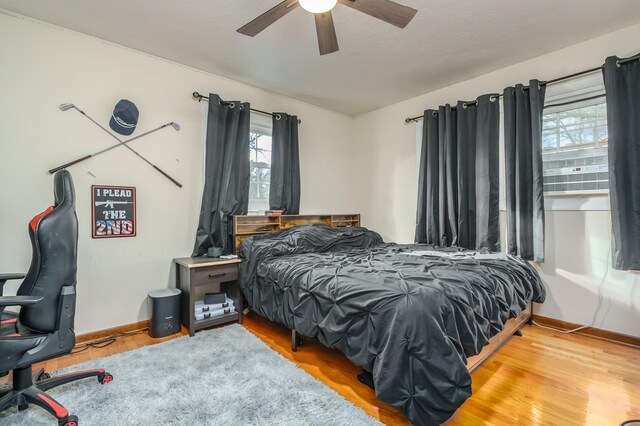 bedroom featuring ceiling fan and light wood-type flooring