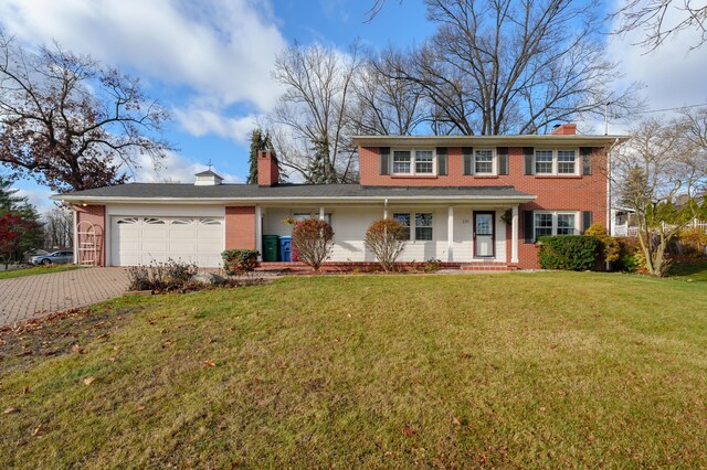 view of front facade featuring a front yard and a garage