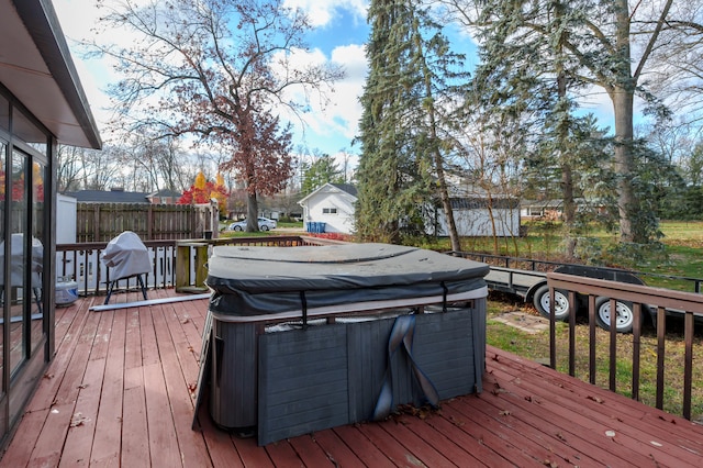 deck featuring a hot tub