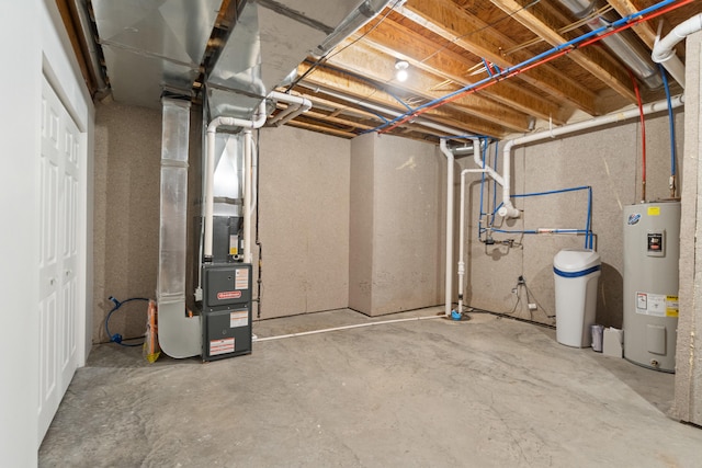 basement featuring electric water heater and heating unit