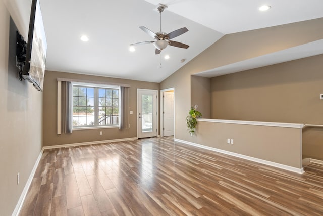 unfurnished living room featuring hardwood / wood-style floors, ceiling fan, and lofted ceiling