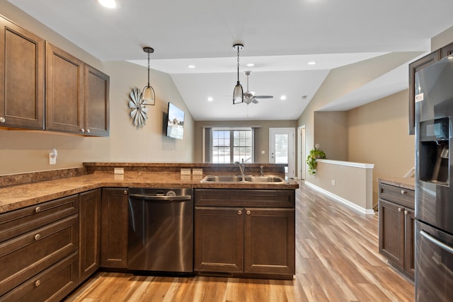 kitchen featuring sink, light hardwood / wood-style flooring, lofted ceiling, and appliances with stainless steel finishes