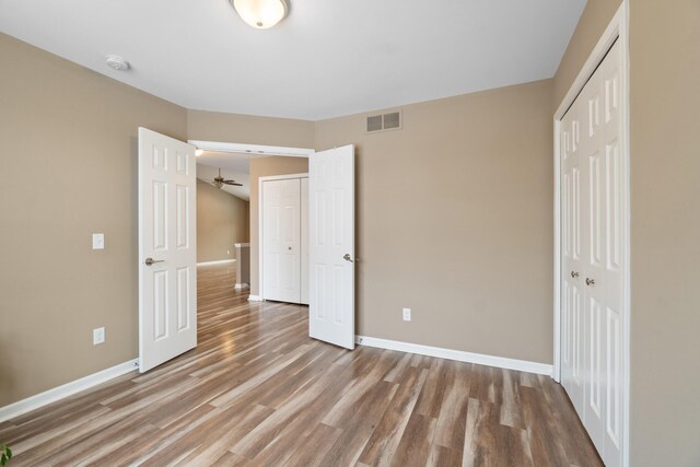 unfurnished bedroom featuring wood-type flooring