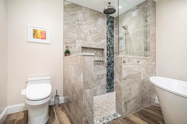 bathroom featuring hardwood / wood-style flooring, toilet, and independent shower and bath