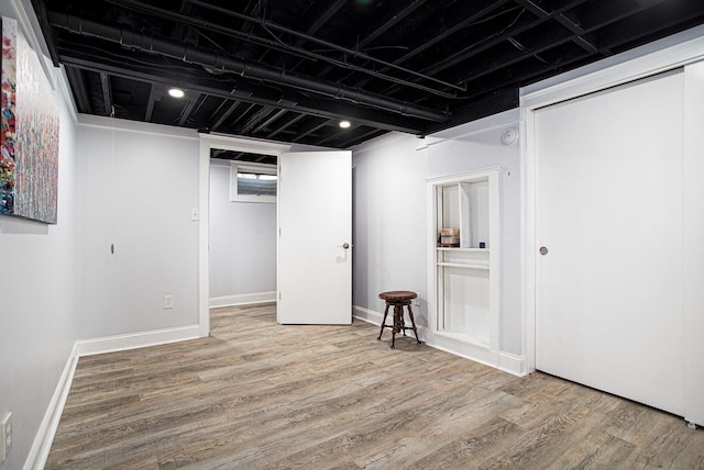 basement featuring hardwood / wood-style flooring