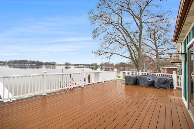 deck featuring a water view