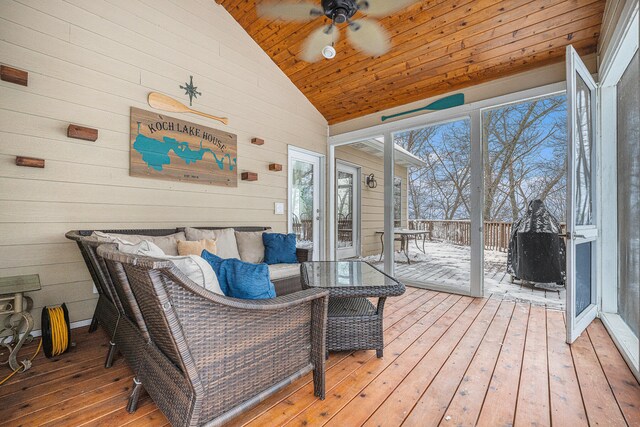 sunroom / solarium with ceiling fan, wood ceiling, and vaulted ceiling