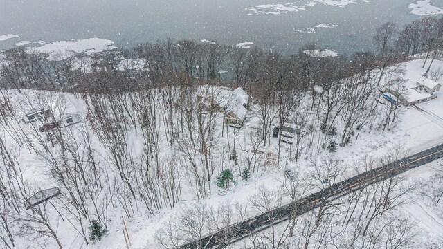 snowy aerial view featuring a mountain view