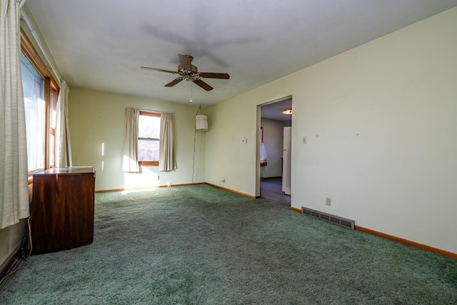 carpeted empty room featuring ceiling fan