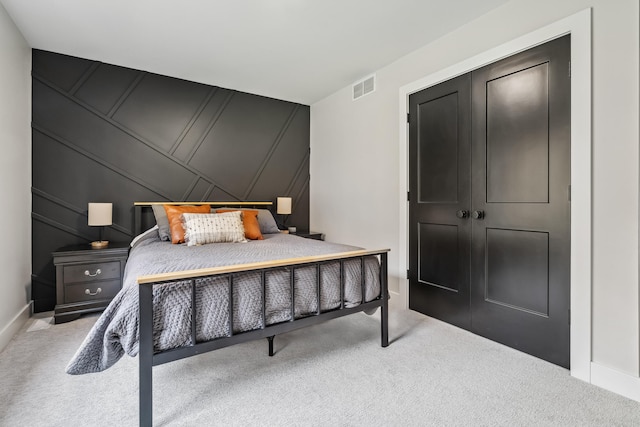 carpeted bedroom featuring a closet